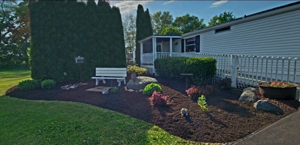 arborvitae mulch bed trenched edging garden bench landscape cleanup before and after trailer Waterloo Indiana
